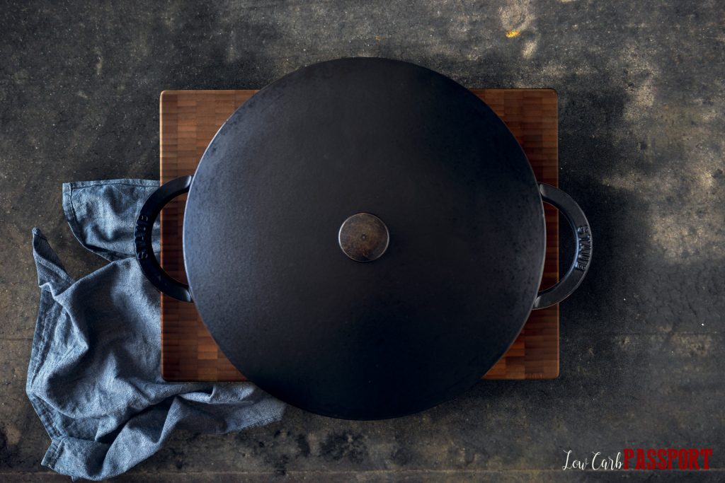 covered cast iron pot containing pork back ribs